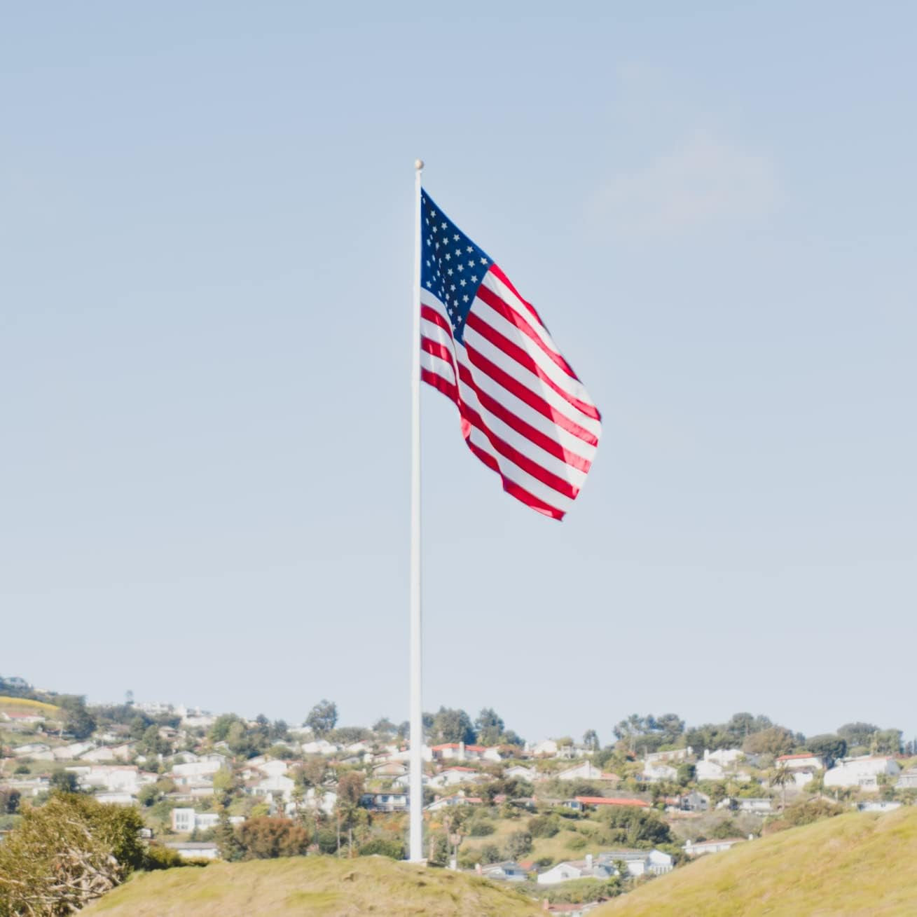 Grace Alley American Flag: 6X10 FT US Flag - 100% Made in USA. Embroidered Stars, Sewn Stripes and Brass Grommets. Fade Resistant, Heavy Duty, Long Lasting Nylon for Outdoor Durability